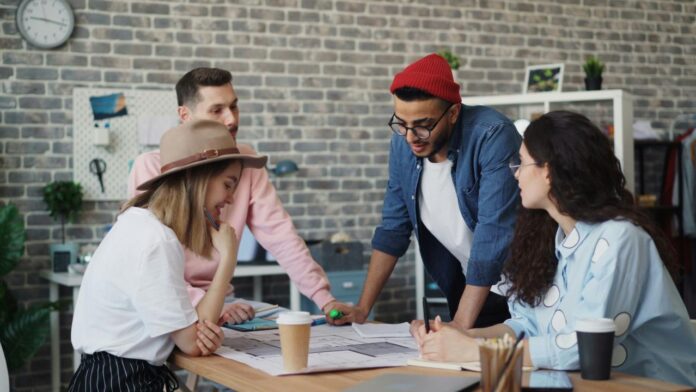 a group of people sitting around a wooden table