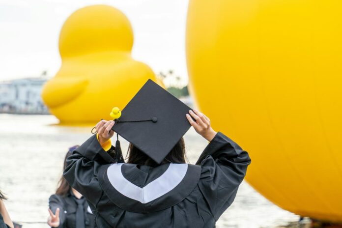 a woman in a graduation cap and gown